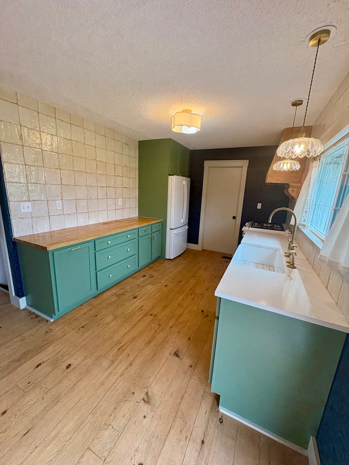 Refinished cabinets, Topeka Painted green kitchen cabinets with butcher block in a Topeka, KS home
